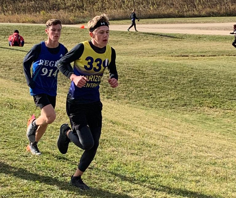 Aiden Yeager (right) competes in the junior boys division of the 2022 SHSAA Provincial Cross Country Championships.